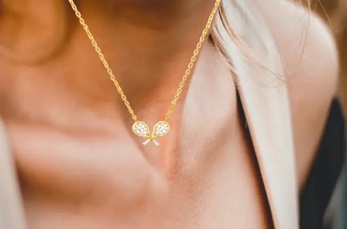 Gold Cross-Racquet Necklace